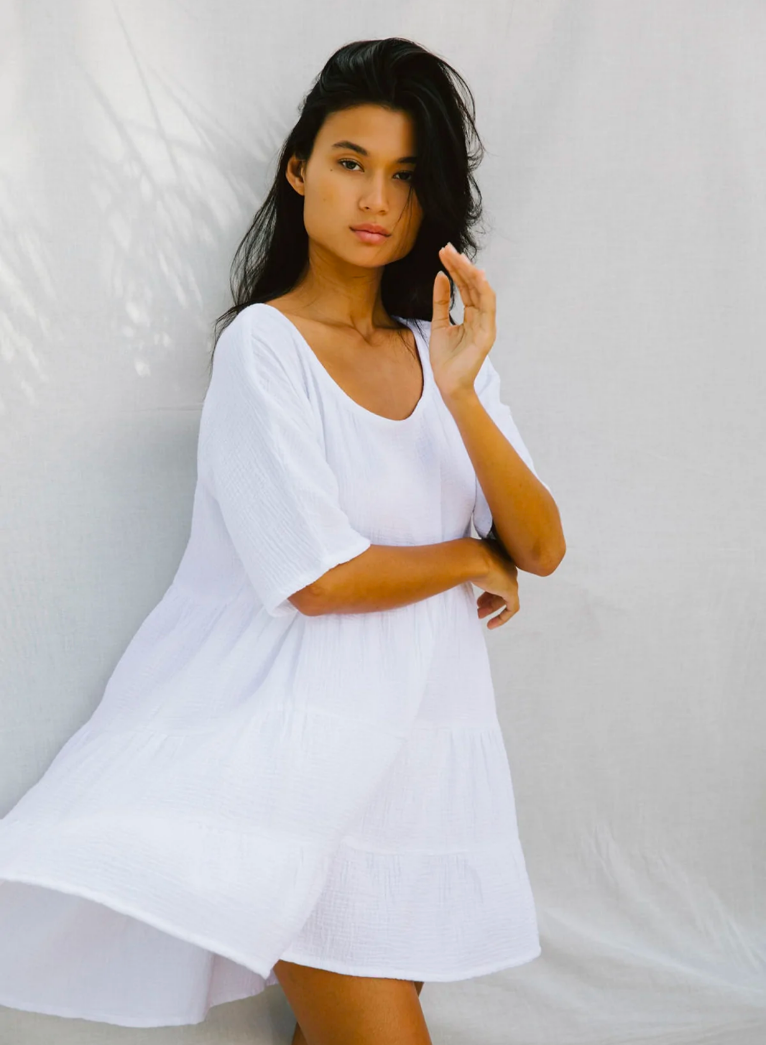 This oversized baby-doll is the perfect chuck on mini dress. Made from the softest natural cotton bubble, you will want to live in this dress all season long.Featuring a flattering scooped neckline a longer sleeve and a tiered baby doll skirt. Paired with sandals or heels it makes a cute day or night outfit.